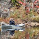 Solo paddler taking pictures.