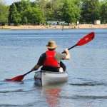 Man paddling canoe